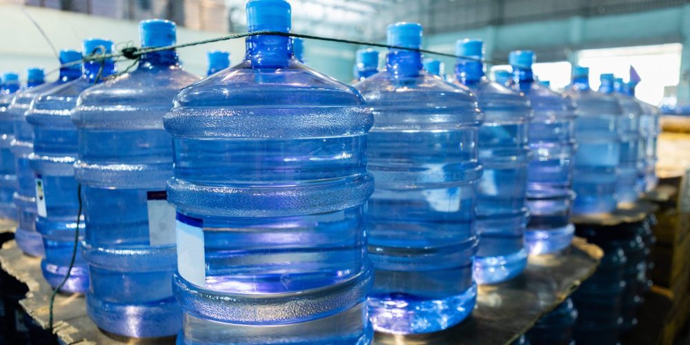 plastic-bottle-or-tank-for-drinking-water-in-produ-2025-03-08-00-04-46-utc-1-A3Q7ppkxrXUD4Xp6